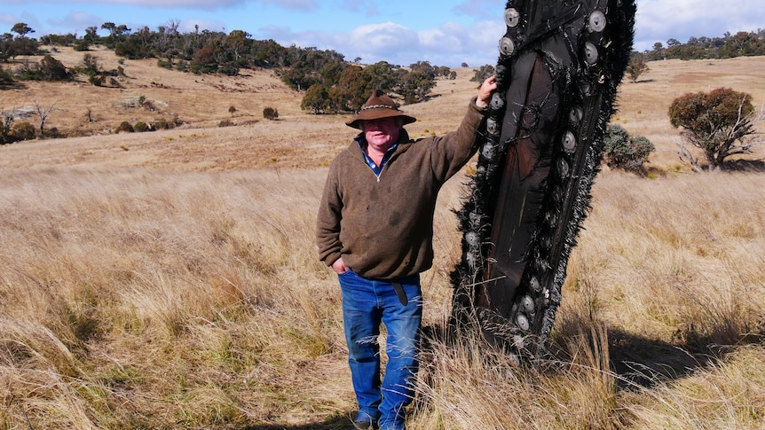 Mick Miners found what is believed to be space junk while mustering sheep on Monday.(ABC South East NSW: Adriane Reardon)